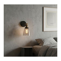 Close-up detail of the Eurolux antique brass & black wall light