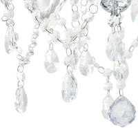 Radiant clear chandelier shown in its packaging