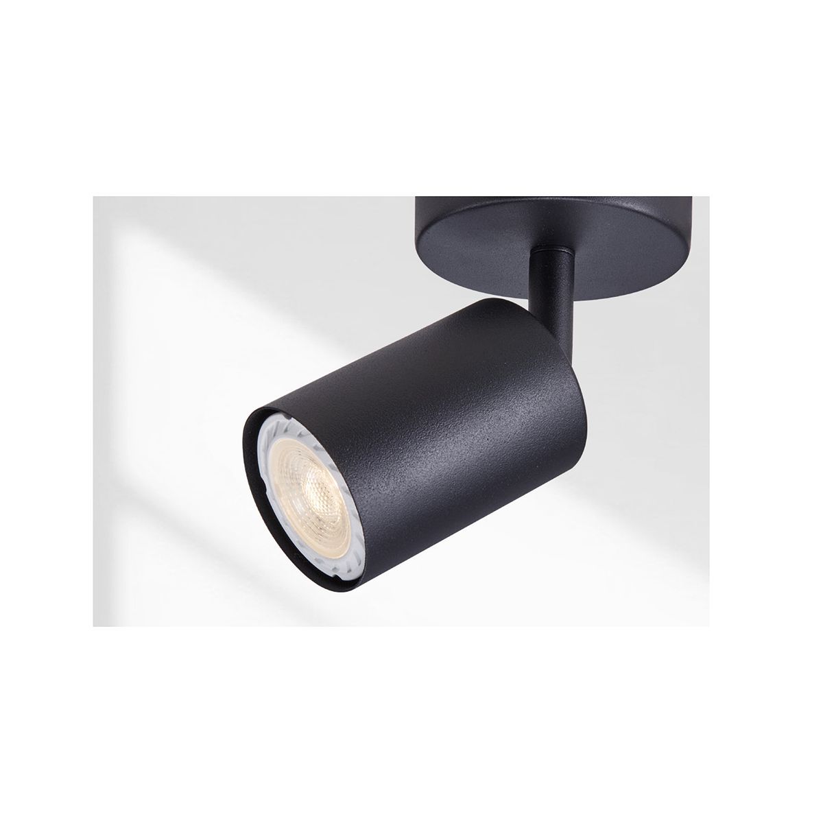 Urban black downlight installed and lit