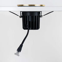 Eurolux polished brass downlight installed and lit